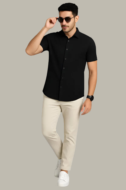 Model wearing a stylish printed half sleeve shirt – perfect for casual outings
